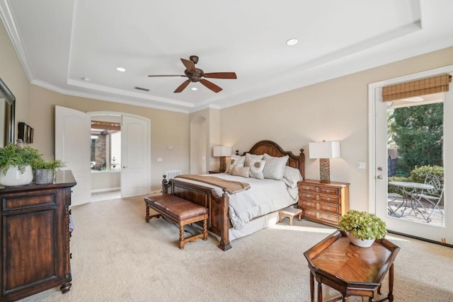 carpeted bedroom featuring access to outside, ornamental molding, a raised ceiling, and ceiling fan