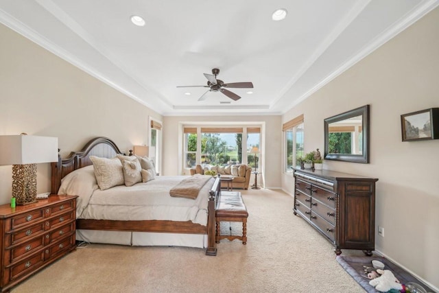 bedroom with ornamental molding, access to outside, light colored carpet, ceiling fan, and a tray ceiling