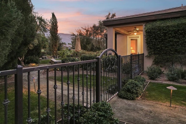 view of gate at dusk