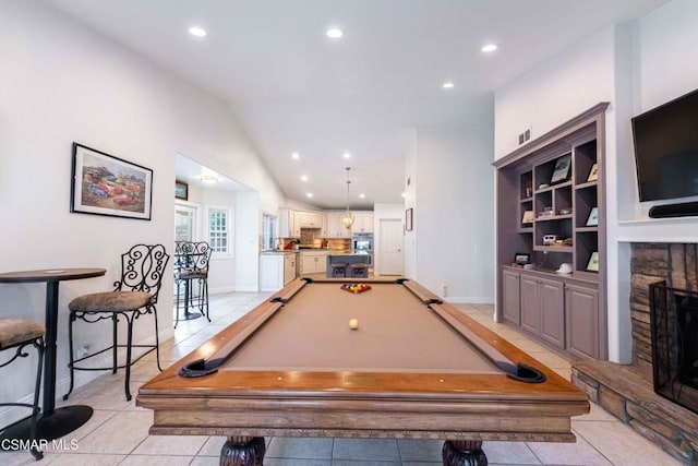 game room featuring lofted ceiling, pool table, a fireplace, and light tile patterned flooring