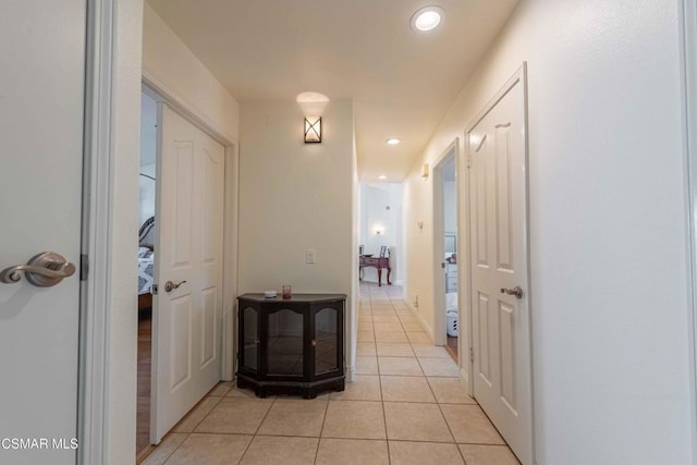 hallway with light tile patterned floors