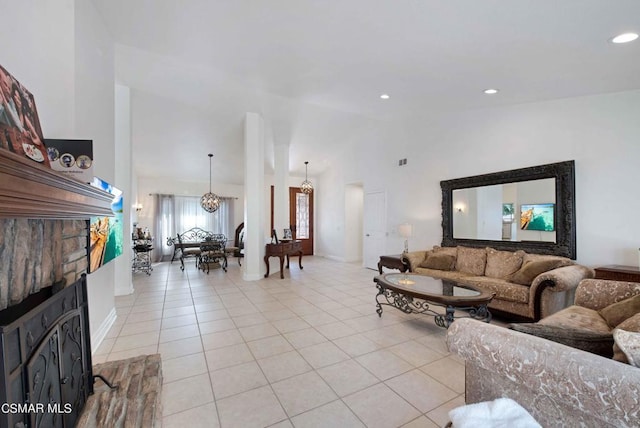 tiled living room with high vaulted ceiling