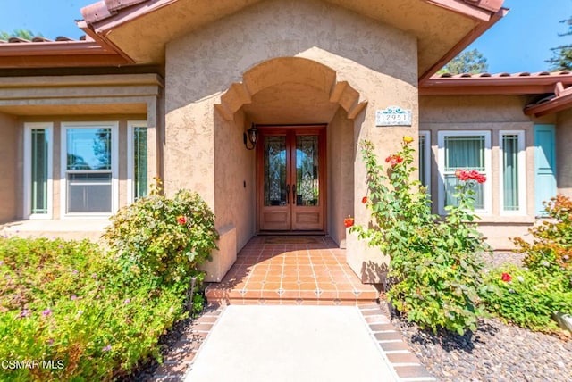 property entrance featuring french doors