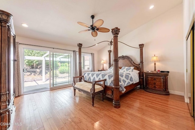 bedroom featuring access to exterior, vaulted ceiling, and light hardwood / wood-style flooring