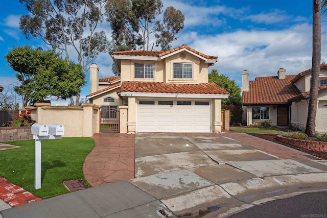 mediterranean / spanish-style house featuring a garage and a front lawn