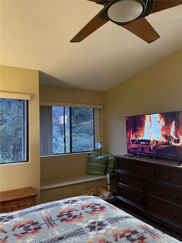 bedroom featuring lofted ceiling and ceiling fan