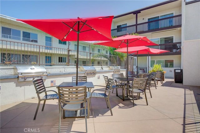 view of patio with area for grilling and exterior kitchen