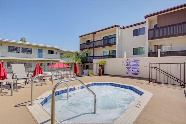 view of pool featuring a hot tub