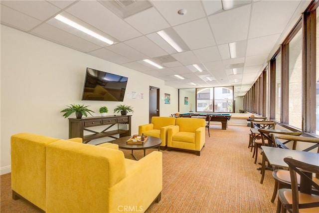 carpeted living room featuring a drop ceiling and billiards