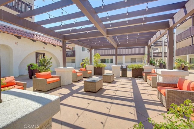 view of patio / terrace with an outdoor living space and a pergola