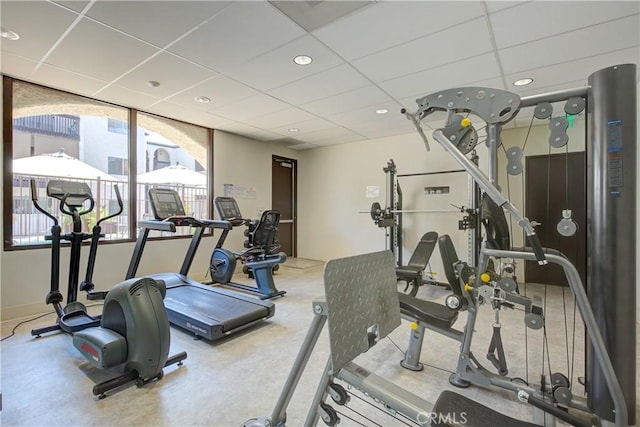 exercise room featuring a drop ceiling