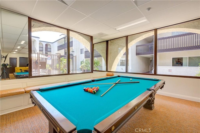 game room with pool table, light carpet, and a drop ceiling