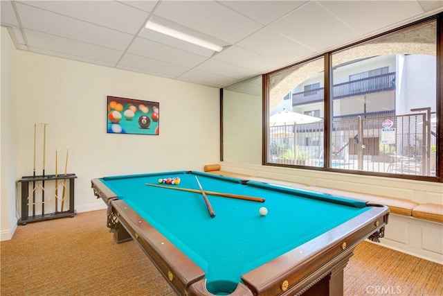 game room featuring carpet flooring and a drop ceiling