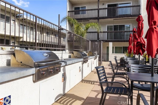 view of patio / terrace featuring sink, grilling area, and exterior kitchen