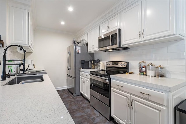 kitchen with sink, appliances with stainless steel finishes, white cabinetry, ornamental molding, and decorative backsplash