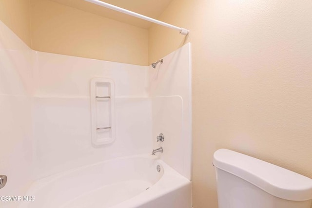 bathroom with toilet and shower / bathing tub combination