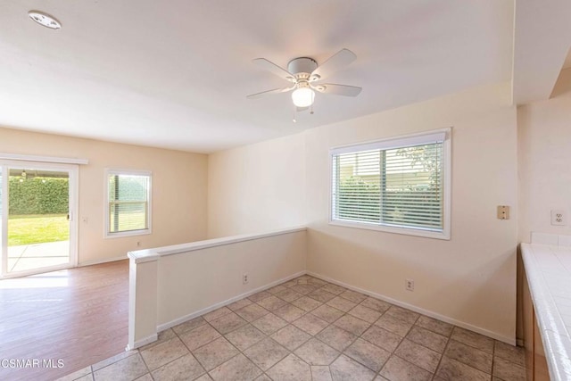 tiled empty room with a wealth of natural light