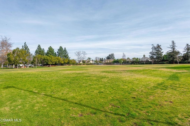 view of home's community featuring a lawn