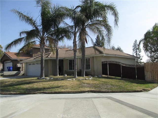 view of front of home with a garage and a front lawn