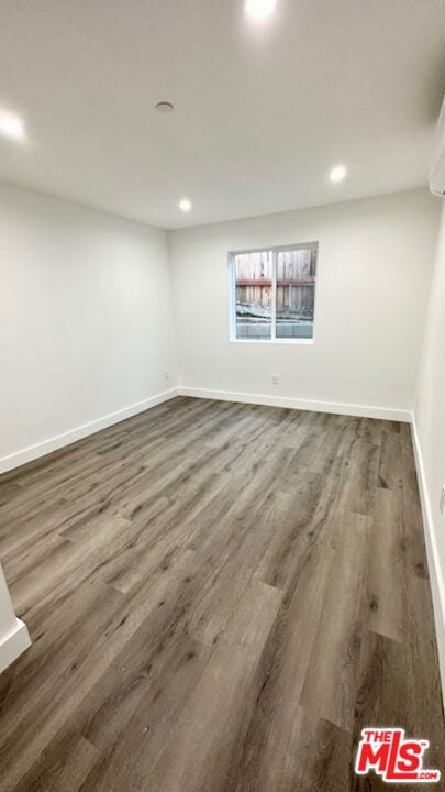 spare room featuring hardwood / wood-style floors