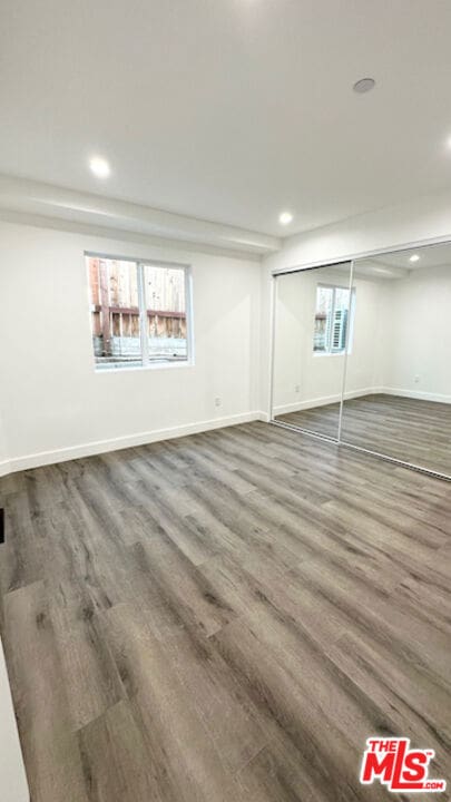 basement featuring hardwood / wood-style flooring