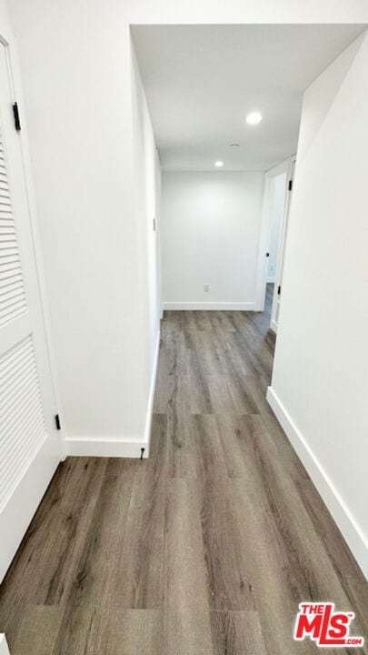 hallway featuring wood-type flooring