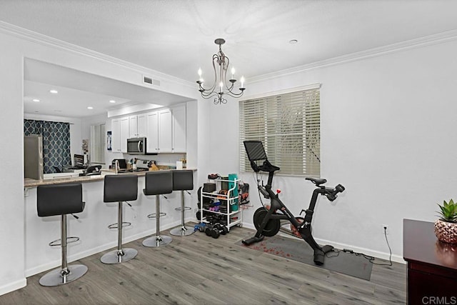 interior space featuring ornamental molding and hardwood / wood-style floors