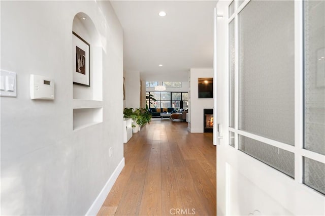 corridor featuring hardwood / wood-style flooring