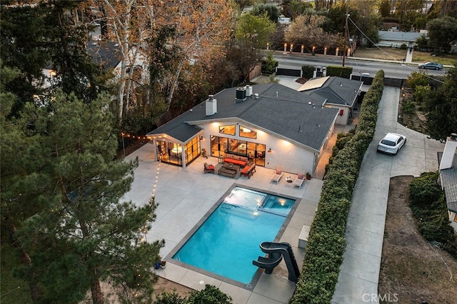 view of swimming pool with central AC, an outdoor hangout area, and a patio