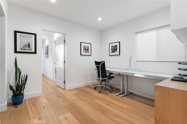 office space with light wood-type flooring