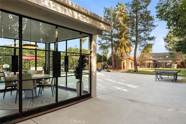 doorway to outside featuring concrete floors