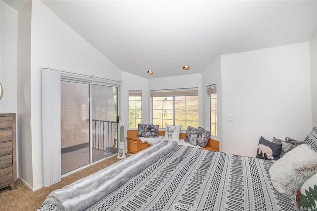 bedroom featuring vaulted ceiling, carpet flooring, and access to outside