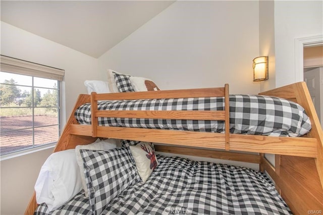 bedroom featuring vaulted ceiling