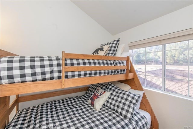 bedroom featuring vaulted ceiling