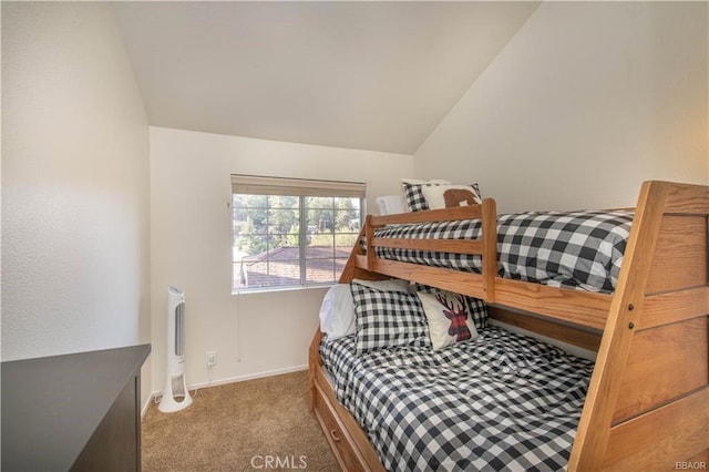 bedroom with light colored carpet and lofted ceiling