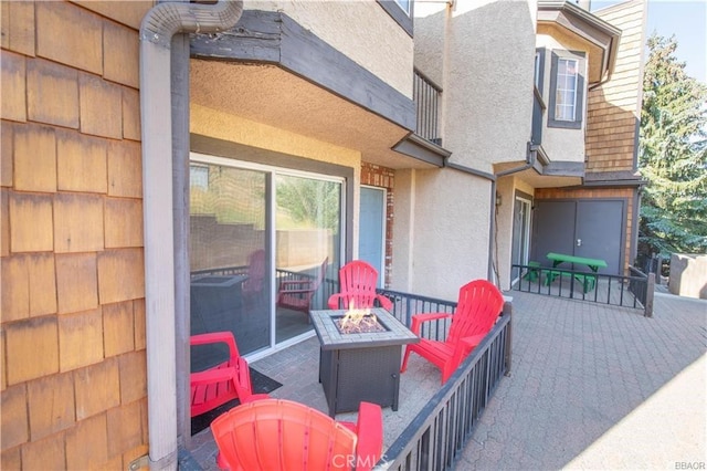 view of patio / terrace featuring a fire pit