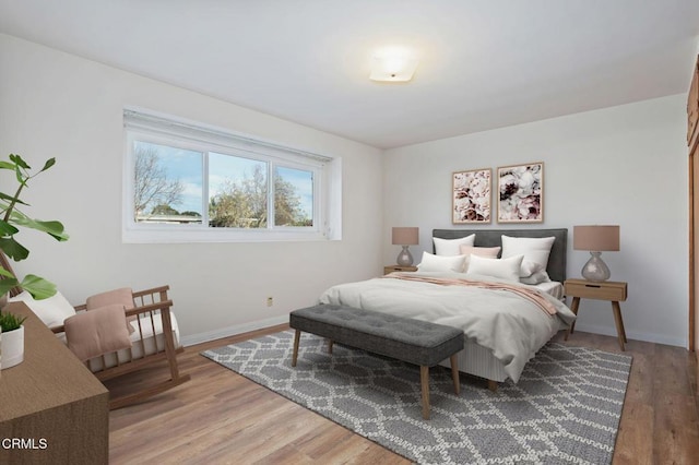 bedroom with hardwood / wood-style flooring