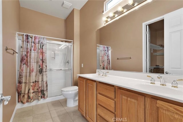 bathroom featuring vanity, tile patterned flooring, toilet, and a shower with shower curtain