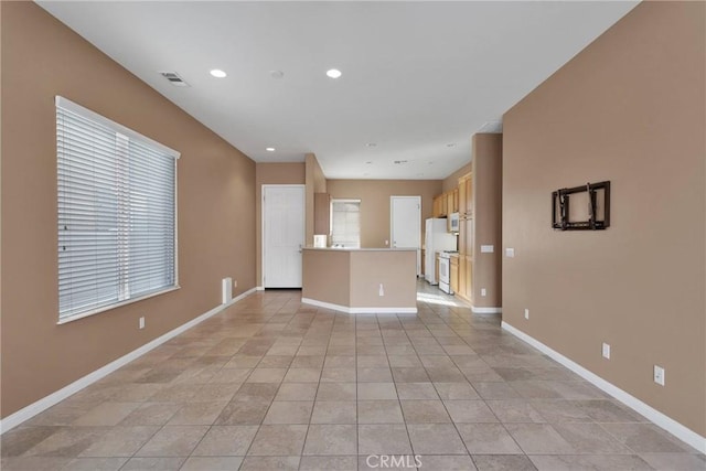 unfurnished living room with light tile patterned floors