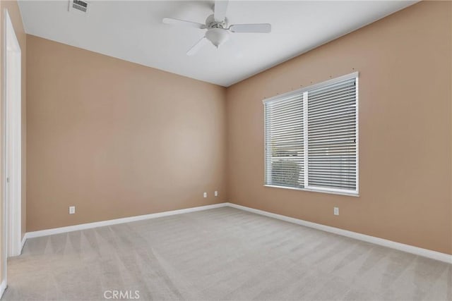 empty room with light carpet and ceiling fan