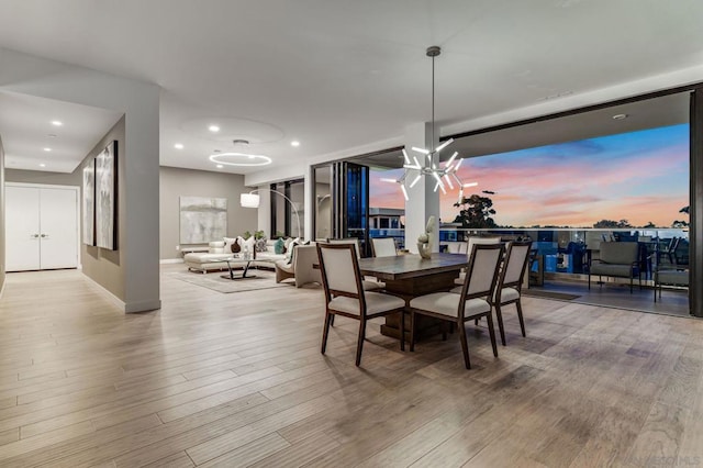 dining space with light hardwood / wood-style floors