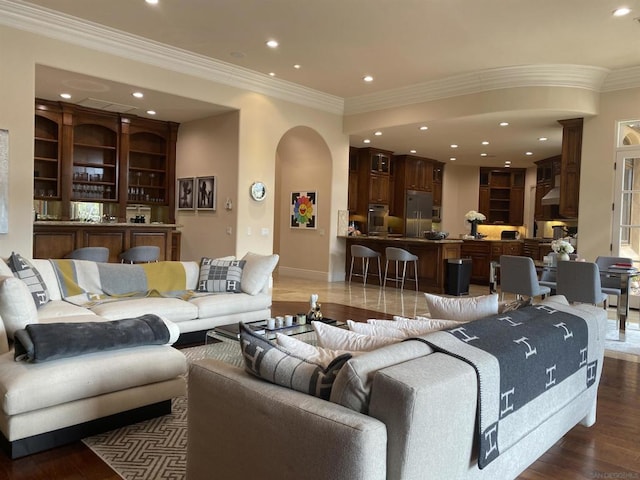 living room featuring crown molding and dark wood-type flooring