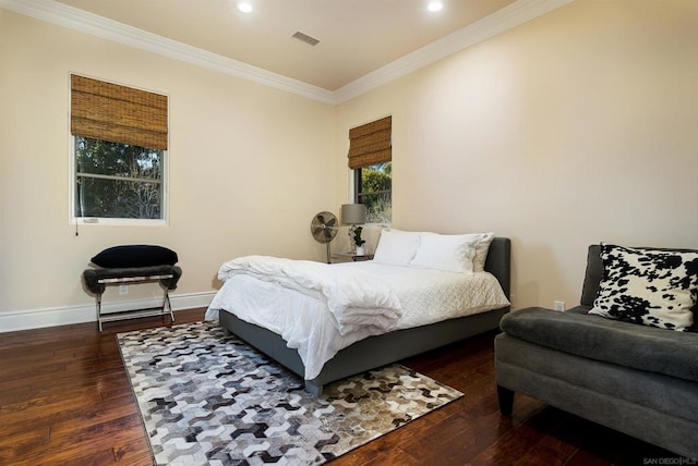 bedroom featuring dark hardwood / wood-style flooring and crown molding