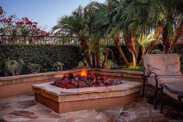 view of patio with a fire pit