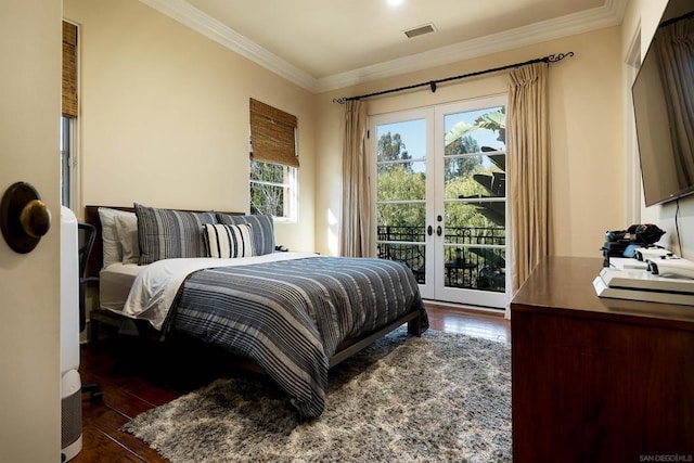 bedroom with ornamental molding, dark hardwood / wood-style floors, access to outside, and french doors