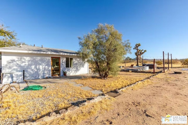 view of front of property featuring a patio area