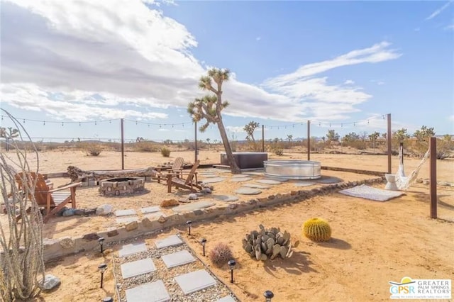 view of yard featuring a fire pit