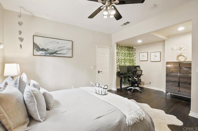 bedroom featuring ceiling fan and dark hardwood / wood-style flooring