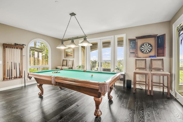 game room featuring a healthy amount of sunlight, dark wood-type flooring, billiards, and french doors