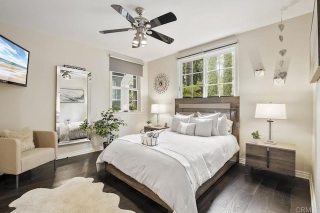 bedroom featuring ceiling fan and dark hardwood / wood-style flooring